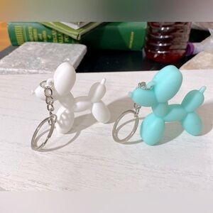 A pair of brand new Ballon dog keychains